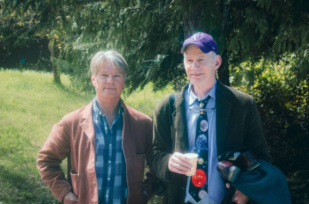 Sequim Gazette photo by Elijah Sussman / John Vaillant and Writer in Residency organizer Rich Riski shuffle-off campus to KONP interview on April 30.