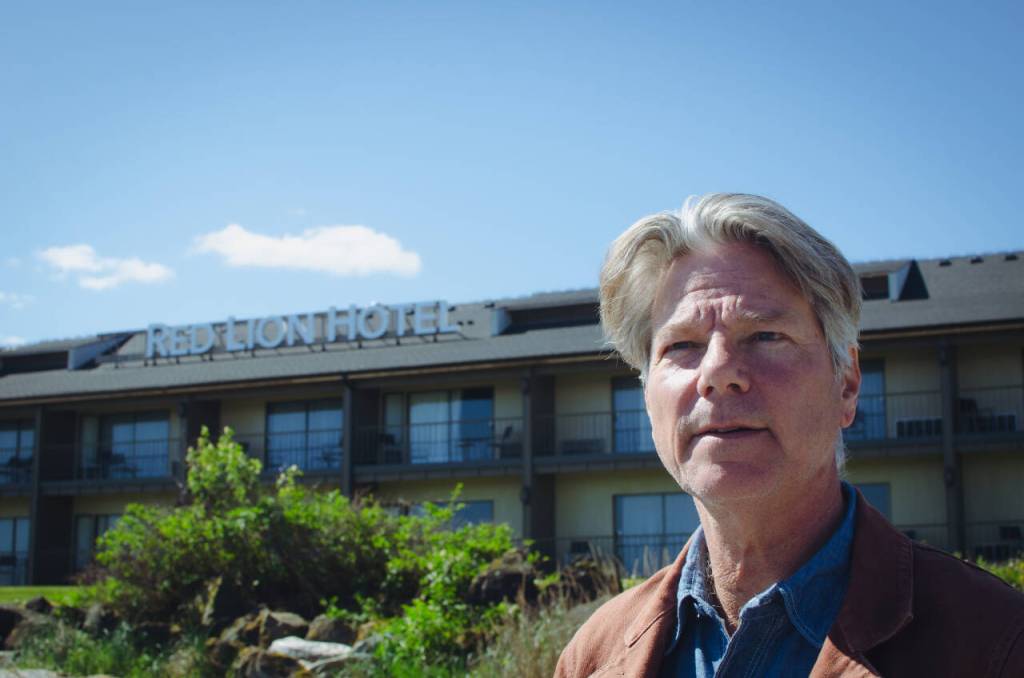 Sequim Gazette photo by Elijah Sussman / Author John Vaillant walks on Hollywood Beach, in front of Red Lion Hotel on May 2.