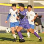 Sequim Gazette photo by Michael Dashiell / Sequims Mekhi Ashby, center, breaks through the Bremerton defense in the first half of the Wolves 4-3 home loss on April 30. Defending the play are Bremertons Evan Harvey (4) and Luis Funez Ramos (16).