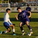 Sequim Gazette photo by Michael Dashiell
Sequims Colin Feik, right, vies with Bremertons Luis Farfan Reyes for the ball in the first half of the Wolves home match-up with the Knights on April 30.