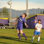 Sequim Gazette photo by Michael Dashiell / Sequims James Mason, left, gets his head on the ball as Bremertons Jerry Santos-Retes looks on, in an Olympic League match-up in Sequim on April 30.