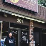 Sequim Gazette photo by Elijah Sussman / New owner Carly Rasmussen stands in front of The Oasis Bar and Grill in Sequim on May 3.