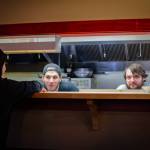 Sequim Gazette photo by Elijah Sussman / Carly Rasmussen (at left), new owner of The Oasis Bar and Grill, shares a moment with kitchen staff Sean Newman (middle) and Josh Sullivan on May 3.