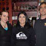 Sequim Gazette photo by Elijah Sussman / Staffer Dawn Ingram, left, new owner Carly Rasmussen, center, and waitstaff Joe Edison take a break from work at The Oasis Bar and Grill on May 3.