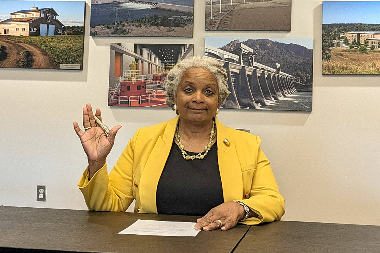Photo courtesy Nicole Hartman/ Clallam PUD/ Newly appointed Clallam PUD commissioner Phyllis Bernard recites her oath of office for district seat No. 3 on May 1.