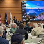 Photo courtesy of Sarge’s Veteran Support / With Cheri Tinker, executive director of Sarge’s Veteran Support, overseeing the event, veteran Jerry Fine leads a live auction to raise funds for the organization at the Dungeness River Nature Center on April 27.