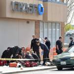 Photo by Keith Thorpe/Olympic Peninsula News Group
Police and rescue workers surround the scene of a disturbance at Chase Bank at Front and Laurel streets in downtown Port Angeles on May 3 that resulted in a fatal shooting and the closure of much of the downtown area.