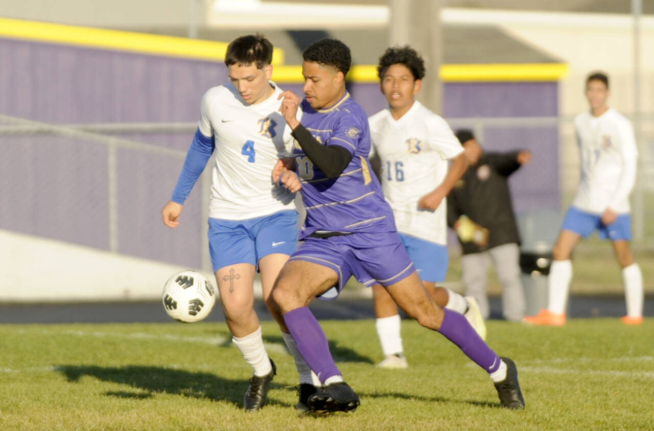Sequim Gazette photo by Michael Dashiell / Sequims Mekhi Ashby (10) dribbles the ball up the field against North Mason on April 30.