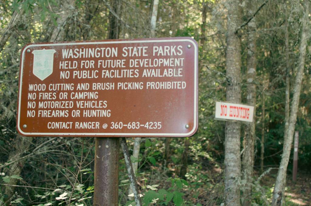 Sequim Gazette photo by Elijah Sussman / A Washington State Park sign at the trailhead of The Discovery Bay Trail outlining the area regulations.