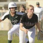 Sequim Gazette photo by Michael Dashiell / Port Angeles' Ava-Anne Sheahan takes a lead off first base behind Sequim first baseman Ava Ritter on May 10.