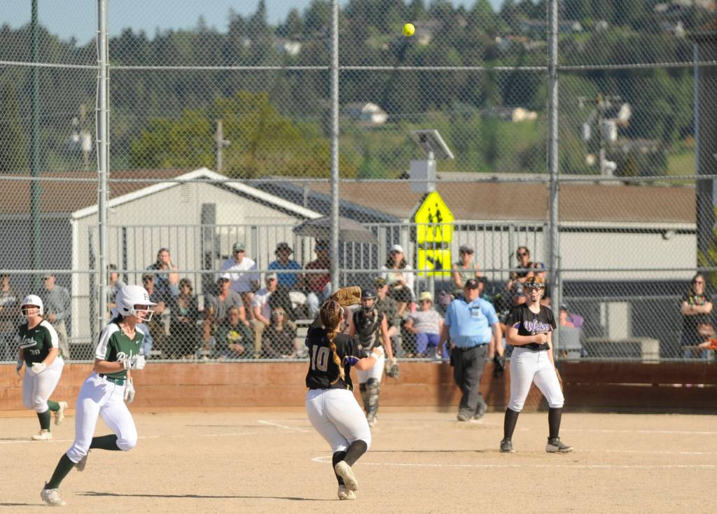 Sequim Gazette photo by Michael Dashiell / Sequims Mikki Green (10) keeps her eyes on a pop fly in the Wolves Olympic League game against port Angeles on May 10.