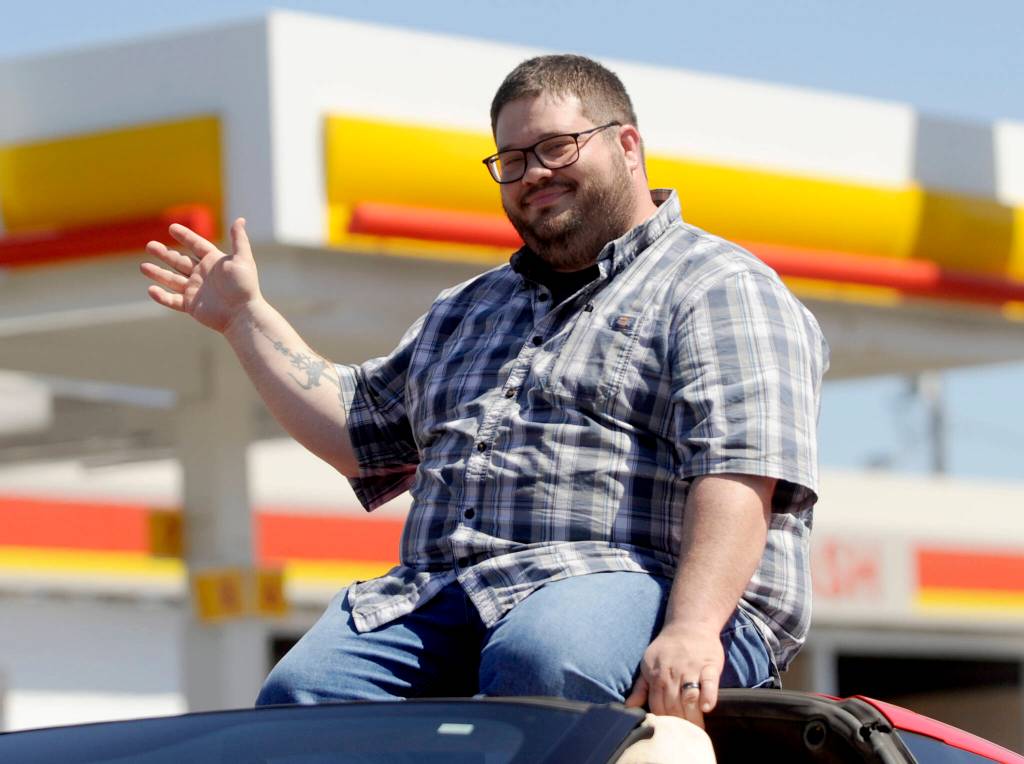 Sequim Gazette photo by Michael Dashiell / Sequim Mayor Brandon Janisse waves to the Sequim Irrigation Festival Grand Parade crowd on Saturday.