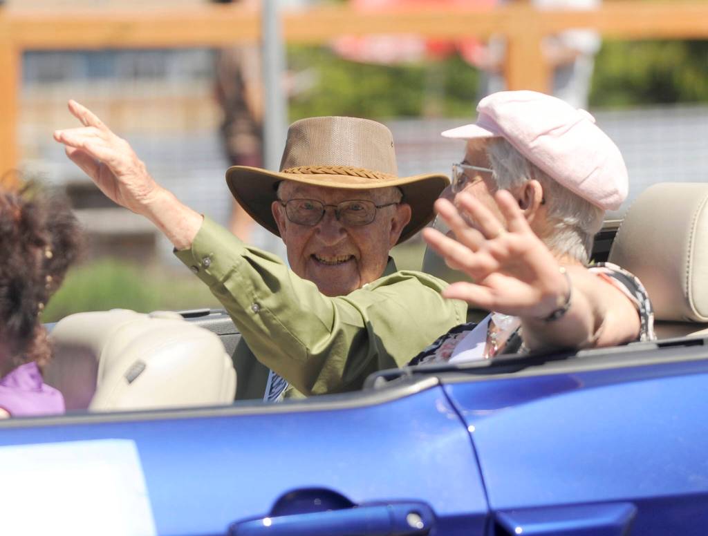 Sequim Gazette photo by Michael Dashiell
2024 Sequim Irrigation Festival Honorary Pioneers Gary and Janice Smith wave to the crowd at the Grand Parade Saturday afternoon.