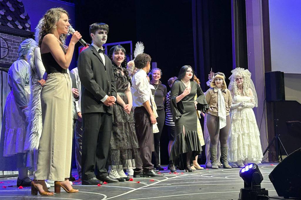 Sequim Gazette photo by Matthew Nash/ Sequim High Schools Operetta Club and Ghostlight Productions celebrate the end of its two-week run of The Addams Family on May 11, with director Anna Pederson thanking volunteers, parents and students who served as cast and crew members.
