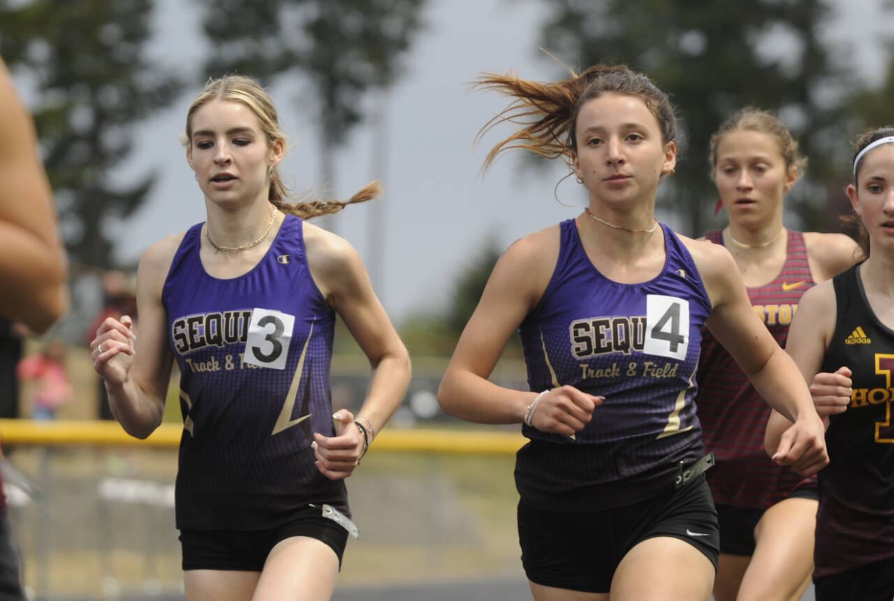 Sequim Gazette photo by Michael Dashiell
Sequims Dawn Hulstedt, left, and Kaitlyn Bloomenrader race to state berths in the 800-meter race at the West Central Bi-district meet in Belfair on May 18. Bloomenrader placed second in the heat and third overall while Hulstedt placed third in the heat and fourth overall.
