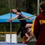 Sequim freshman Clare Turella leaps over the high jump bar en route to a district championship, eventually clearing a personal-best 5-3 in the West Central B-district meet event in Belfair on May 18.