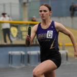 Sequim Gazette photo by Michael Dashiell / Sequim junior Ivy Barrett helps Sequims 4x400 relay team earn a state meet berth at the West Central B-district meet event in Belfair on May 18.