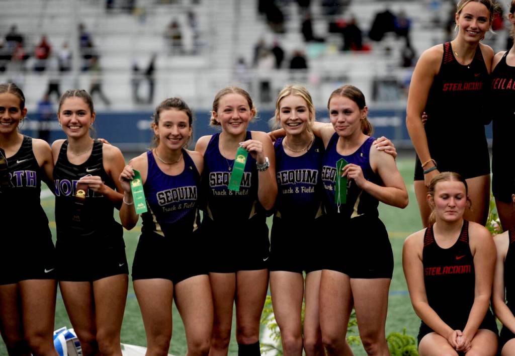 Sequim Gazette photo by Michael Dashiell / Sequim Highs girls 4x400 relay team is all smiles after placing fourth at the West Central B-district meet event in Belfair on May 18. Pictured, from left, are Kaitlyn Bloomenrader, Bailey Stein, Dawn Hulstedt and Ivy Barrett.
