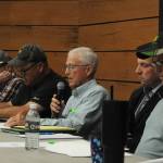 Sequim Gazette photo by Matthew Nash/ Gary Smith, center, reads a statement to shareholders of the Sequim Prairie Tri-Irrigation Association on May 14 inside the Dungeness River Nature Center that their special meeting is meant to continue the 2024 annual meeting after it was disrupted and elect four board members, two for 2023 and 2024.