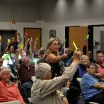 Sequim Gazette photo by Matthew Nash/ Julie Vig, secretary/treasurer for the Sequim Prairie Tri-Irrigation Association, tallies votes during a special meeting of shareholders. Board members continued the associations February annual meeting on May 14 after contention over proper notification about meetings and their legitimacy. Shareholders voted to reinstate board members from 2023.