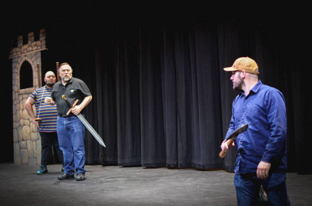 Sequim Gazette photo by Elijah Sussman / Spamalot actors (from left) Mario Arruda, Ron Graham and Hunter Gilliam rehearse a scene at Olympic Theatre Arts on May 15.