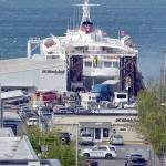 KEITH THORPE/PENINSULA DAILY NEWS
Smoke vents from the rear car deck doors as firefighters battle a vehicle fire aboard the ferry MV Coho upon its afternoon arrival in Port Angeles on Thursday.