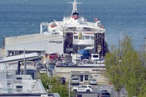 KEITH THORPE/PENINSULA DAILY NEWS
Smoke vents from the rear car deck doors as firefighters battle a vehicle fire aboard the ferry MV Coho upon its afternoon arrival in Port Angeles on Thursday.