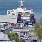 Photo by Keith Thorpe/Olympic Peninsula News Group / Smoke vents from the rear car deck doors as firefighters battle a vehicle fire aboard the ferry MV Coho upon its afternoon arrival in Port Angeles on May 16.