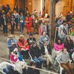 Photo credit Zion Hilliker / Pride Picnic attendees gather in the barn at B&B Family Farm during a Pride Picnic in June 2023.