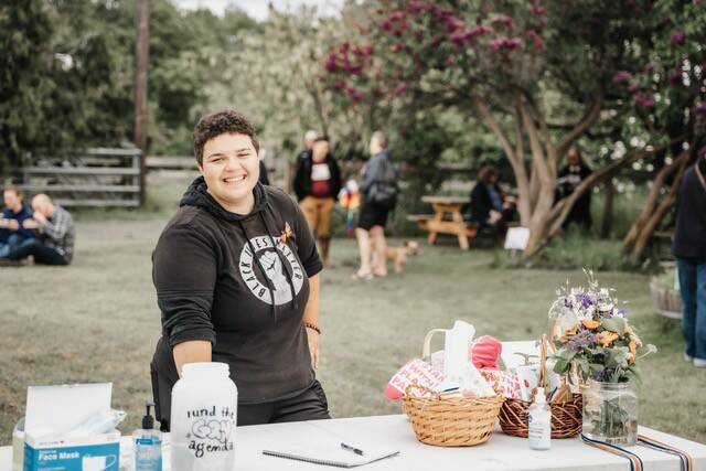 Photo by Zion Hilliker 
SisterLand Farm employee Eli Smith enjoys a previous Pride Picnic in June 2022.