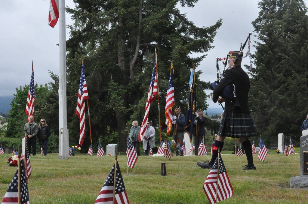 Sequim Gazette photo by Matthew Nash/ Rick McKenzie plays the bagpipes to open a Memorial Day ceremony in Sequim View Cemetery.