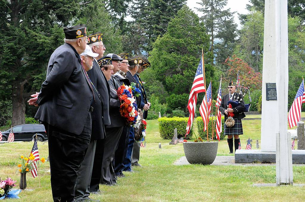 Sequim Gazette photo by Matthew Nash
Rick McKenzie plays the bagpipes to open a Memorial Day ceremony in Sequim View Cemetery with members of the Veterans of Foreign War Post 4760 and American Legion Jack Grennan Post 62 standing at attention.