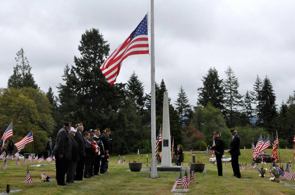 Sequim Gazette photo by Matthew Nash/ Members of the Veterans of Foreign War Post 4760 and American Legion Jack Grennan Post 62 hold a Memorial Day ceremony on May 27 in Sequim View Cemetery honoring those lost while serving in the U.S. armed forces. It was one of five ceremonies held in the Sequim area between the two groups on the day of remembrance.