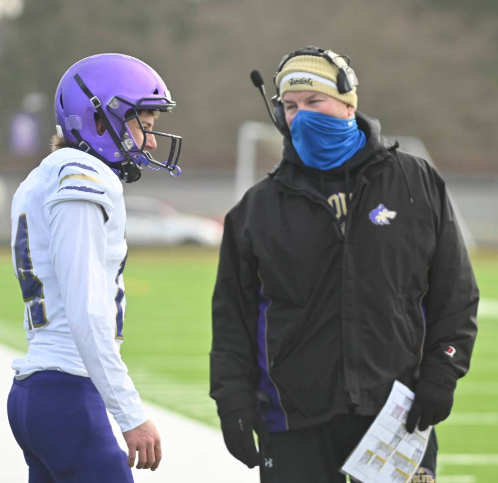 Sequim Gazette file photo by Michael Dashiell / Sequim head coach Erik Wiker talks with Kobe Applegate during the COVID pandemic-affected season in February 2021.