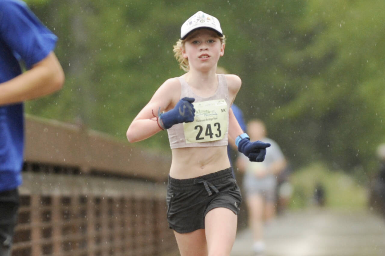 Sequim Gazette photos by Michael Dashiell
Eleanor Jones, 11, of Sequim wins the Sequim Railroad Run on April 27, taking first among the women in the 5k by two minutes. It was not her first Run the Peninsula first-place medal.