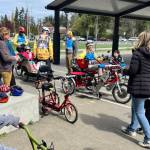 Photos courtesy of Sequim Wheelers
Volunteers from Sequim Wheelers offer rides and speak with students at Salish Coast Elementary School in Port Townsend in April.