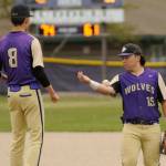 Sequim Gazette photo by Michael Dashiell / Sequim third baseman Ayden Holland, right, bounces the ball to his pitcher Ethan Staples in between innings of an April 24 league match-up with North Mason. Holland was named to the all-Olympic League second team.