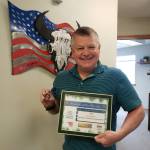 Photo courtesy of Joe DAmico / 
Joe DAmico, president/CEO of Security Services Northwest, Inc., receives a Diamond Award from the from the Michael Trebert Chapter of the Daughters of the American Revolution (DAR) for supporting the annual Wreaths Across America event.