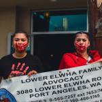 Sequim Gazette photo by Elijah Sussman / Tlinget sisters Marciella Salazar and EmaLya Salazar hold sign in front of Elwha Klallam Heritage Center on May 3.