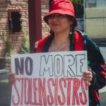 Sequim Gazette photo by Elijah Sussman / Cheyenne Wheeler holds a sign reading NO MORE STOLEN SISTERS on march from Elwha Cultural Heritage Center to Civic Field on May 3.