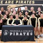 Photo courtesy of Peninsula College / Peninsula Colleges Hannah Wagner of Sequim in May signs to play soccer for Vancouver Island University surrounded by her teammates and assistant coach Andrew Cooper and head coach Kanyon Anderson. Wagner was also the womens soccer team recipient of the Wally Sigmar and Art Feiro awards for leadership, academics and citizenship.