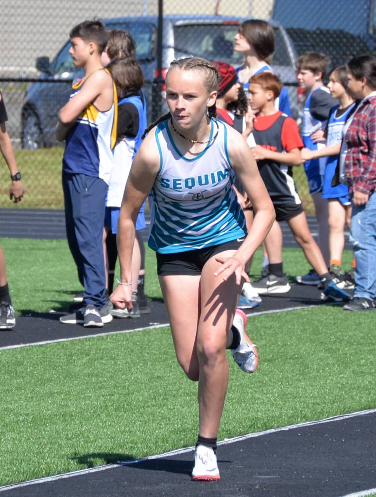 Photo by Caleb Gentry / Emma Desjardins of Sequim looks for a good mark in the long jump at a league meet in Forks earlier this spring.