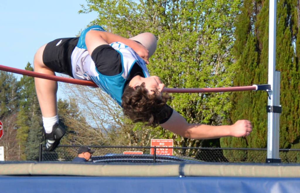 Photo by Caleb Gentry / Matia Divinsky of Sequim clears the high jump bar in a 2024 league meet in Forks.