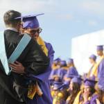 Sequim Gazette photo by Michael Dashiell / Graduating Sequim High School senior Sage Younger gets a big hug from dad Joe Younger, an SHS teacher who is retiring at the end of the school year, at the Sequim High graduation ceremony on June 14.