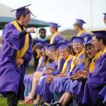 Sequim Gazette photo by Michael Dashiell / Sequim High senior Roger Burwash pumps up fellow SHS graduates at the schools June 14 commencement ceremony.