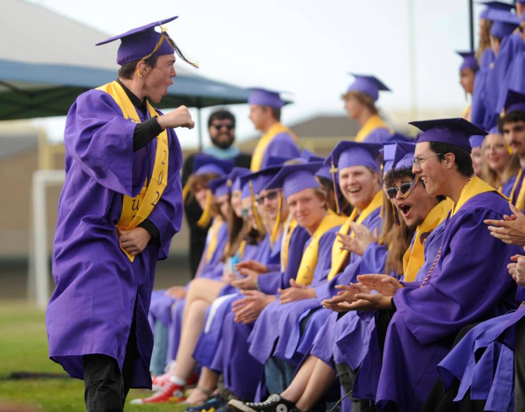 Sequim Gazette photo by Michael Dashiell / Sequim High senior Roger Burwash pumps up fellow SHS graduates at the schools June 14 commencement ceremony.