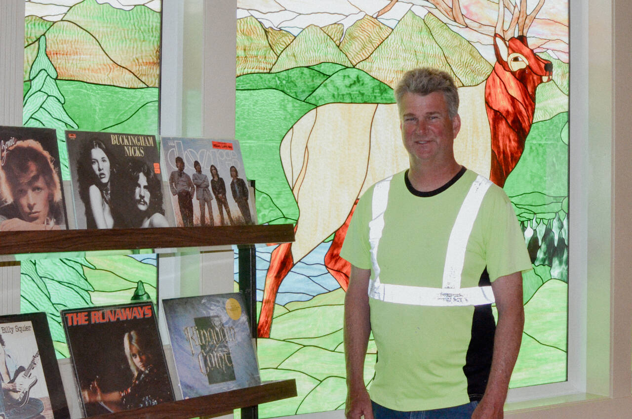Sequim Gazette photo by Elijah Sussman / Sequim Record Show organizer Gary Butler shows off a few of his records at The Guy Cole Center on May 30.