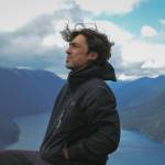 Sequim Gazette photo by Elijah Sussman / Ian Maksin is seated over Lake Crescent at Storm King viewpoint on a recent hike.