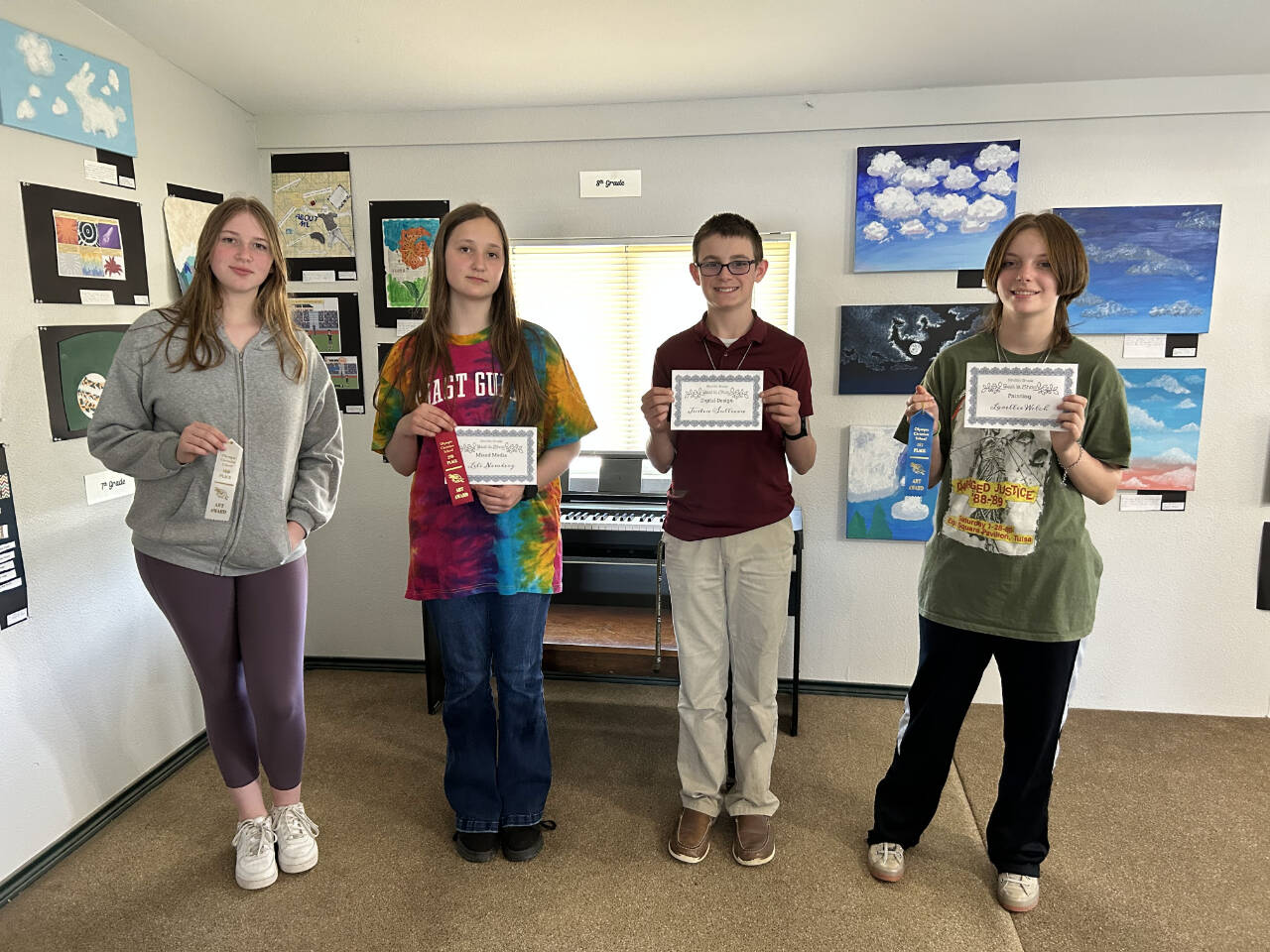 Photo courtesy of Olympic Christian School
From left, Olympic Christian School eighth-graders Miya Allen, Lili Newberg, Justin Sullivan and Lorellie Welch display their honors at OCSs annual Art Festival.