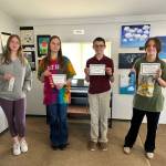 Photo courtesy of Olympic Christian School
From left, Olympic Christian School eighth-graders Miya Allen, Lili Newberg, Justin Sullivan and Lorellie Welch display their honors at OCSs annual Art Festival.